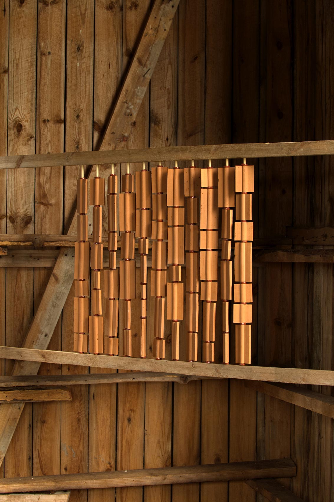 Revolve modular space divider, terracotta rods, 2024
